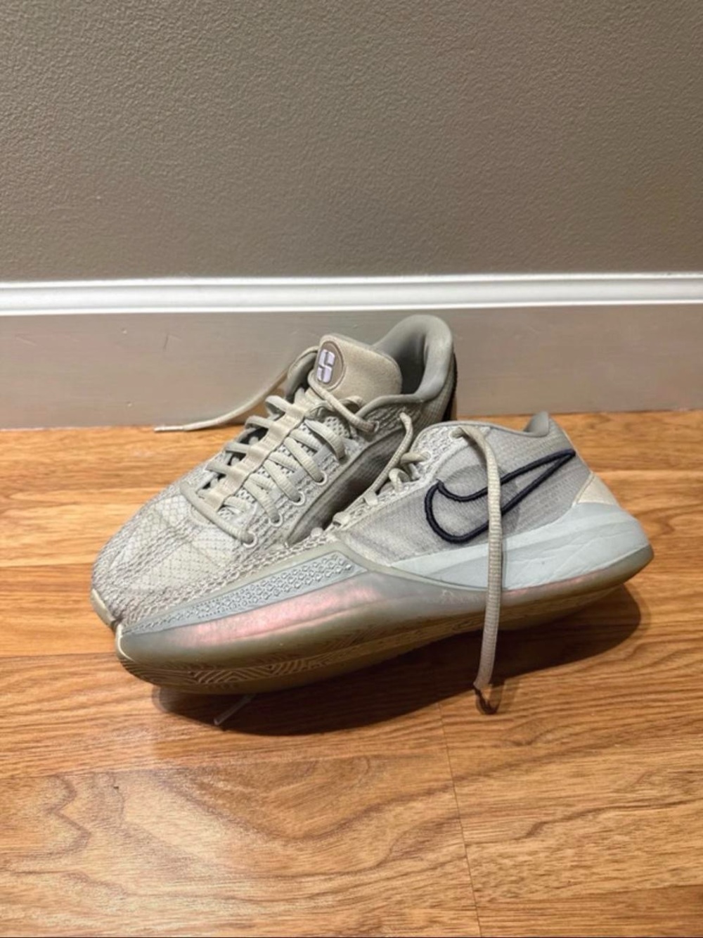Nike Women’s Low-Top Sneakers in Light Beige with Black Swoosh